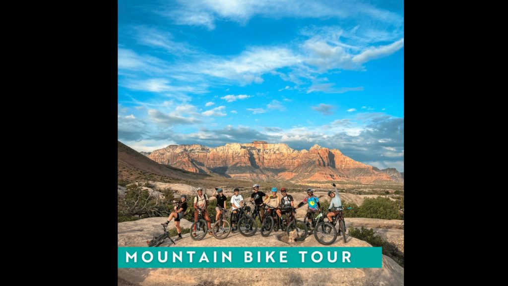 Zion-Cycles-guided-mountain-bike-tour-group-with-red-rock-canyon-views-in-Southern-Utah