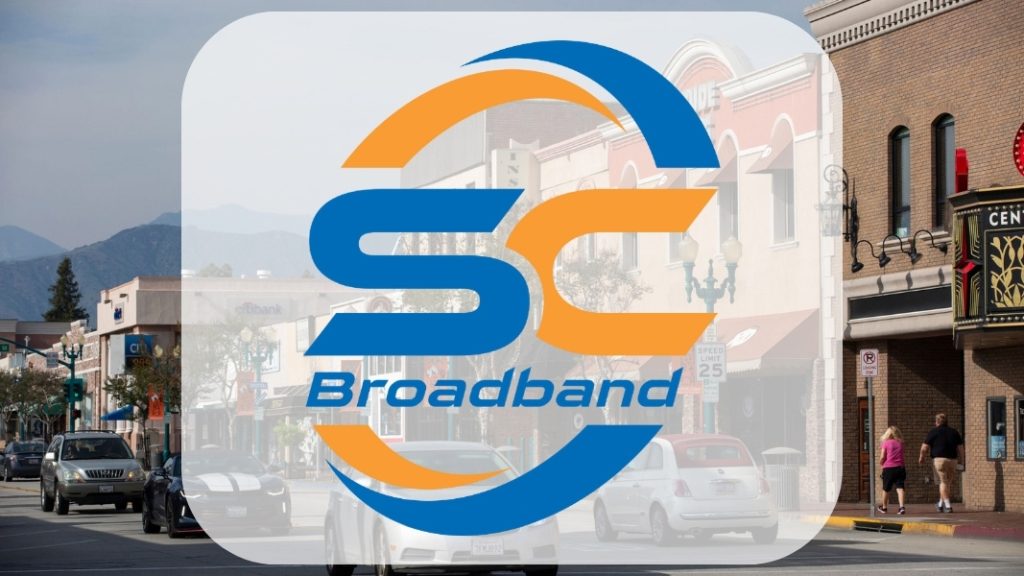 South-Central-Broadband-logo-with-Cedar-City,-Utah-downtown---Local-fiber-internet,-business-solutions,-and-managed-IT-services-for-Southern-Utah